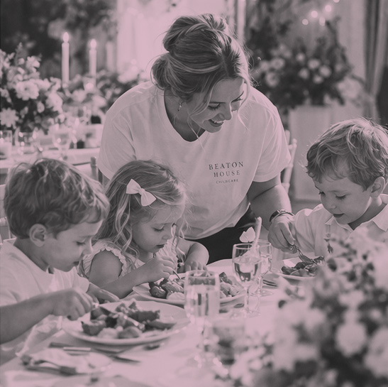 Children crafting with childcare worker